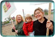 UN-GOLDEN ARCHES: (l-r) Tess Kissinger, Beatrice Wright and Madeline Holler want a new grocery store instead of a McDonaldâs on this vacant lot. 